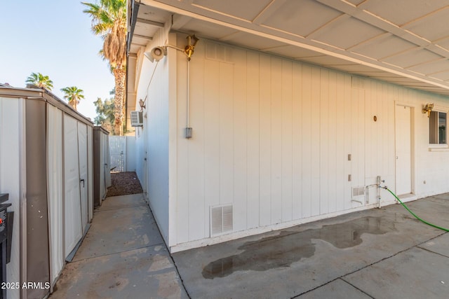 view of side of property with a patio area