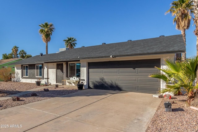 ranch-style home featuring a garage