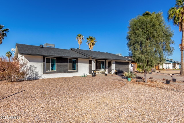 single story home with a garage