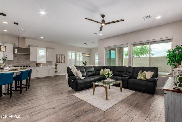 1557 E Flower St, Gilbert, AZ 85298 - living room featuring light wood-style floors, a wealth of natural light, visible vents, and recessed lighting