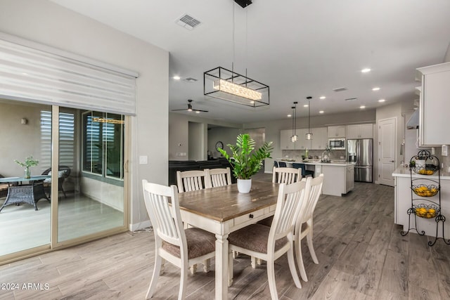 1557 E Flower St, Gilbert, AZ 85298 - dining space featuring light wood-type flooring, visible vents, ceiling fan, and recessed lighting