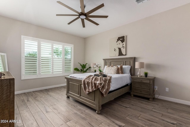 1557 E Flower St, Gilbert, AZ 85298 - bedroom with visible vents, ceiling fan, baseboards, and wood finished floors