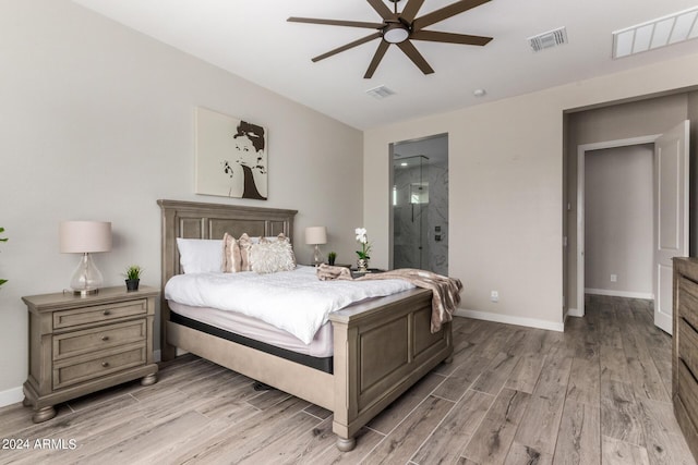 1557 E Flower St, Gilbert, AZ 85298 - bedroom with light wood-style flooring, visible vents, and baseboards