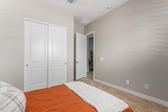 1557 E Flower St, Gilbert, AZ 85298 - bedroom featuring a closet, light colored carpet, visible vents, and baseboards