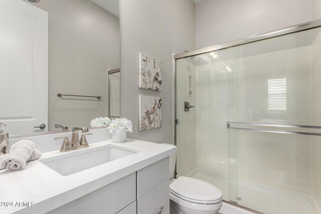 1557 E Flower St, Gilbert, AZ 85298 - bathroom with a stall shower, vanity, and toilet