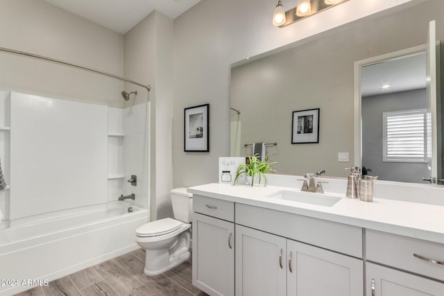 1557 E Flower St, Gilbert, AZ 85298 - bathroom featuring  shower combination, vanity, wood finished floors, and toilet