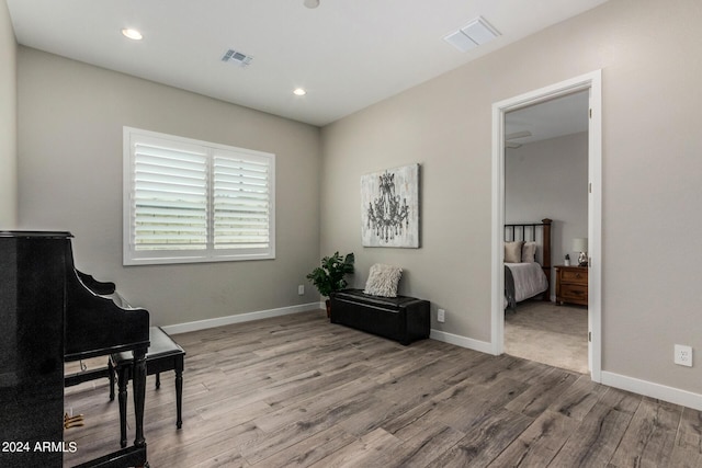 1557 E Flower St, Gilbert, AZ 85298 - living area featuring visible vents, baseboards, and wood finished floors