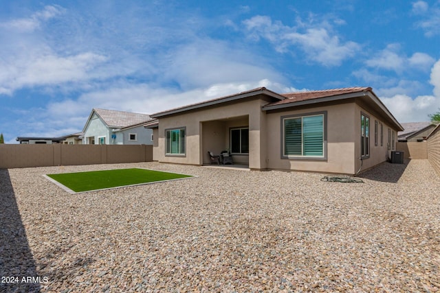 1557 E Flower St, Gilbert, AZ 85298 - rear view of house with a fenced backyard, a patio, cooling unit, and stucco siding