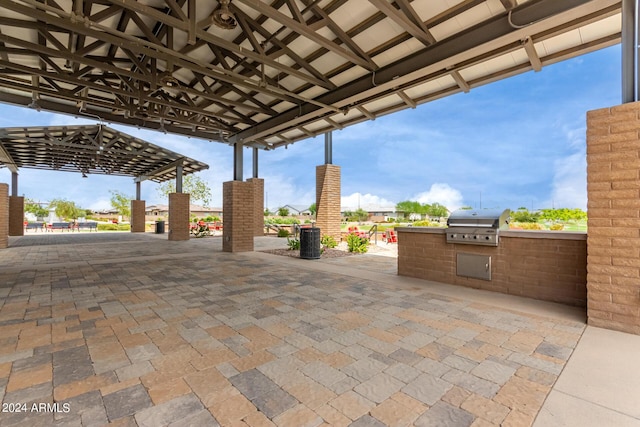 1557 E Flower St, Gilbert, AZ 85298 - view of patio / terrace featuring exterior kitchen and a grill