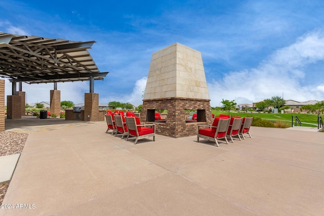 1557 E Flower St, Gilbert, AZ 85298 - view of patio / terrace featuring an outdoor brick fireplace
