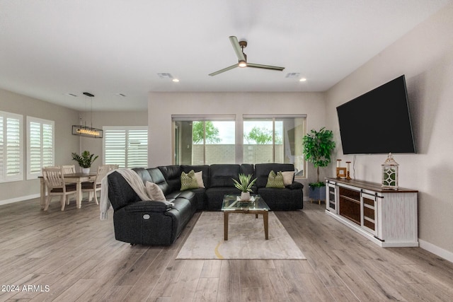 1557 E Flower St, Gilbert, AZ 85298 - living area with ceiling fan, wood finished floors, visible vents, and baseboards