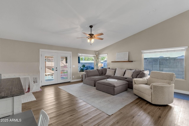 living room featuring french doors, ceiling fan, lofted ceiling, and hardwood / wood-style flooring