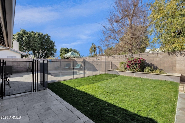 view of yard featuring a pool and a patio