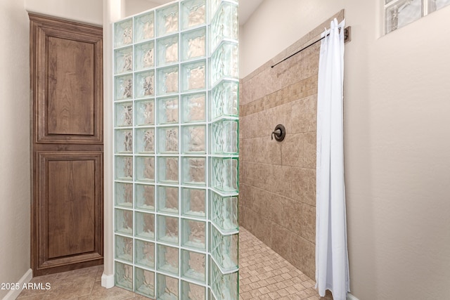 bathroom featuring tile patterned floors and walk in shower