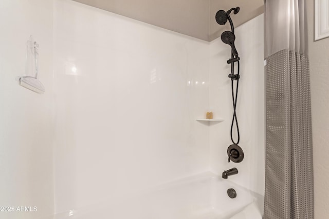 room details featuring shower / tub combo