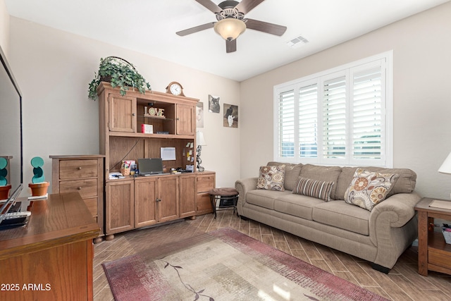 living room featuring ceiling fan, wood finish floors, and visible vents