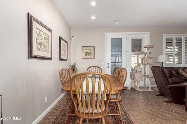 dining space featuring dark wood-style floors, baseboards, visible vents, and recessed lighting