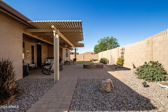 view of patio featuring a fenced backyard, a pergola, and a ceiling fan