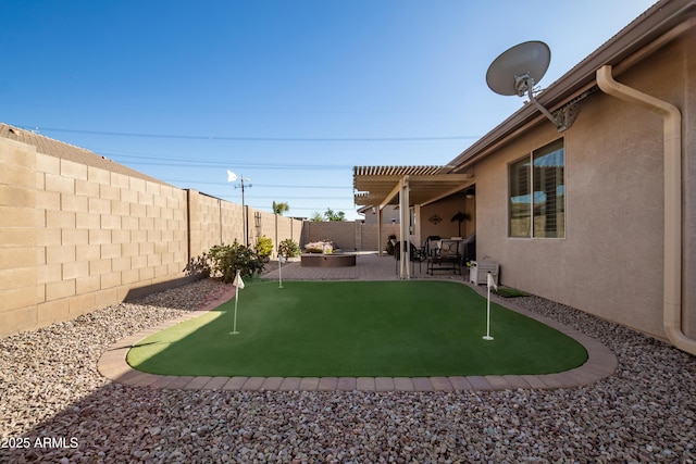 view of yard with a patio area, a fenced backyard, and a pergola