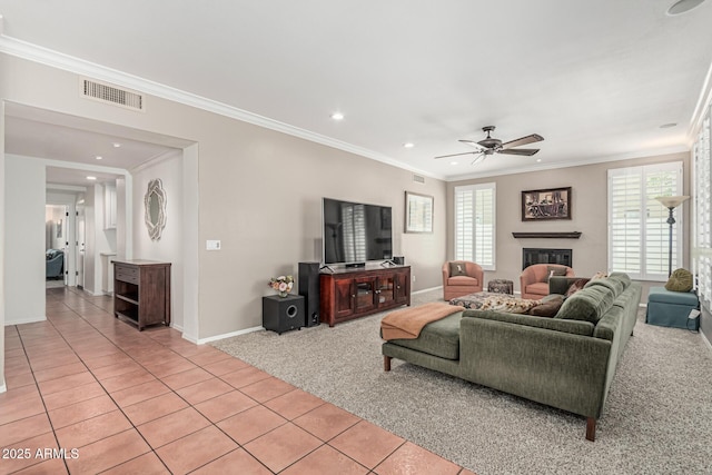 living room with ceiling fan, light carpet, ornamental molding, visible vents, and recessed lighting