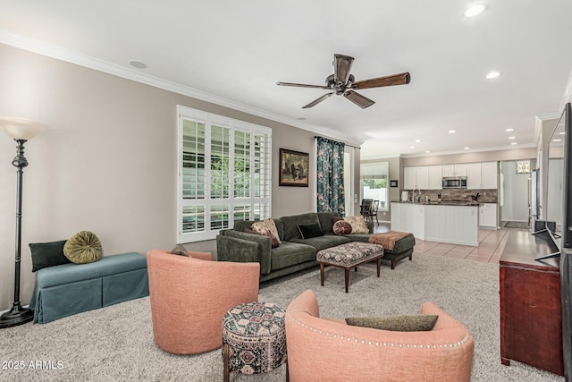 living room featuring ceiling fan, ornamental molding, light tile patterned flooring, and recessed lighting