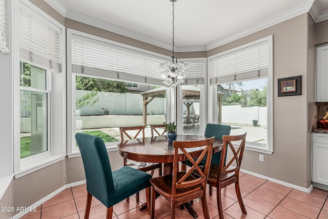 dining space featuring a wealth of natural light, light tile patterned floors, and crown molding
