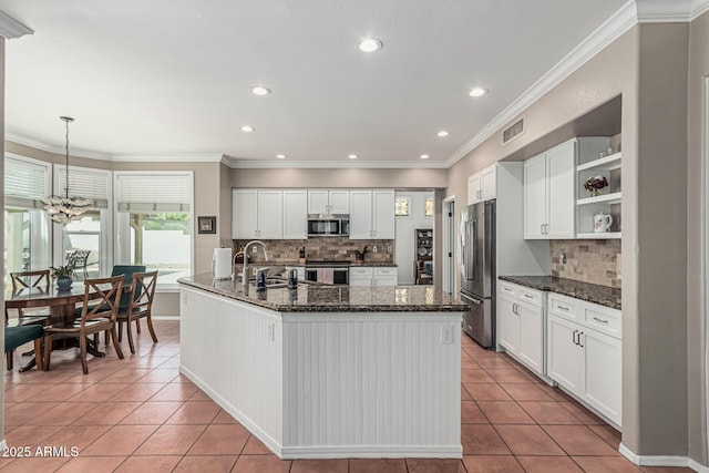 kitchen featuring open shelves, backsplash, visible vents, light tile patterned flooring, and appliances with stainless steel finishes