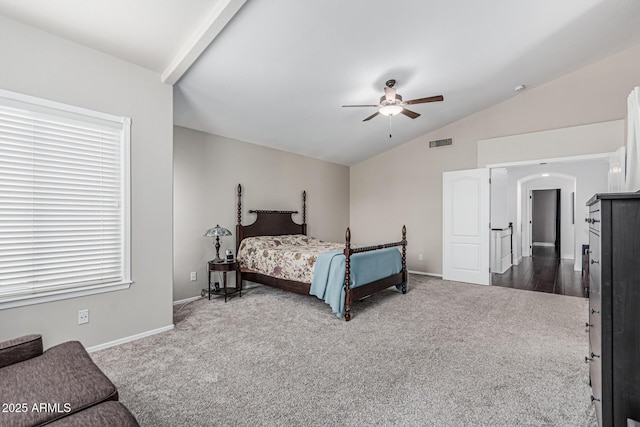 bedroom featuring lofted ceiling, baseboards, dark colored carpet, and visible vents