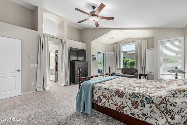 carpeted bedroom with lofted ceiling, a ceiling fan, visible vents, and baseboards