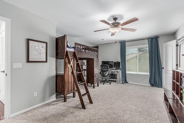 bedroom featuring carpet floors and baseboards