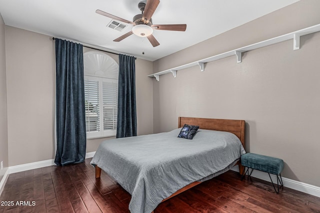 bedroom featuring hardwood / wood-style flooring, baseboards, a ceiling fan, and visible vents