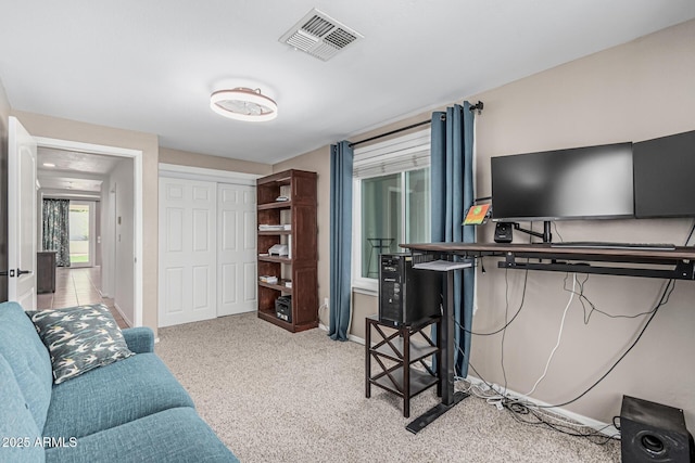 office space with baseboards, visible vents, and carpet