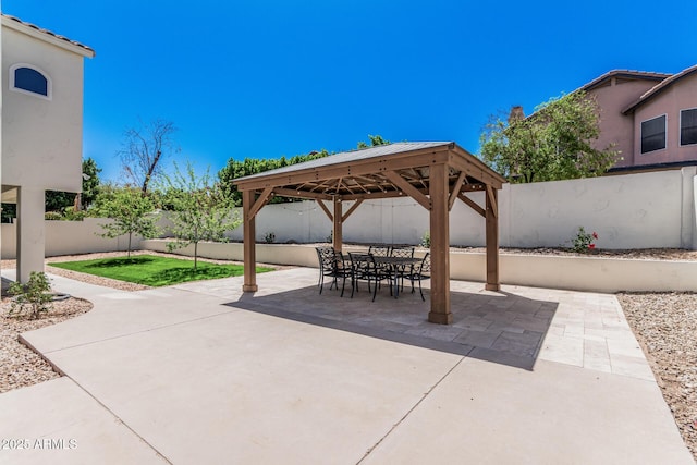 view of patio featuring a fenced backyard and a gazebo