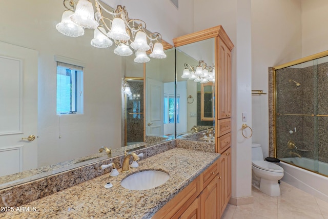 full bath with tile patterned floors, toilet, combined bath / shower with glass door, an inviting chandelier, and vanity