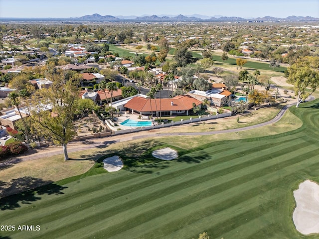 bird's eye view featuring view of golf course and a mountain view
