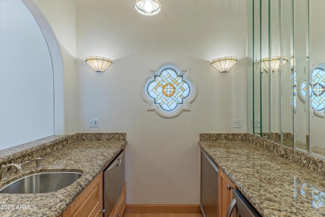 bathroom with vanity and baseboards