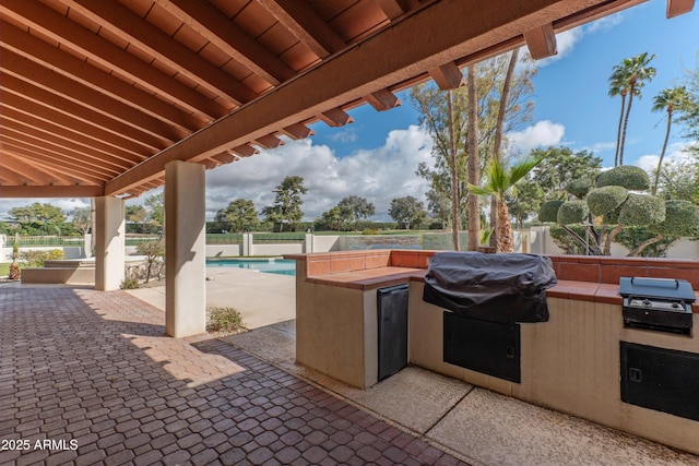view of patio with area for grilling, fence private yard, and grilling area