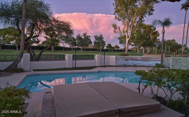 view of pool with a fenced in pool, a patio, and fence