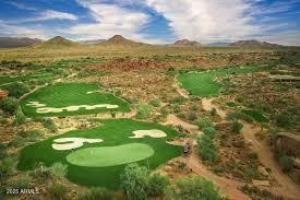 surrounding community with view of golf course and a mountain view