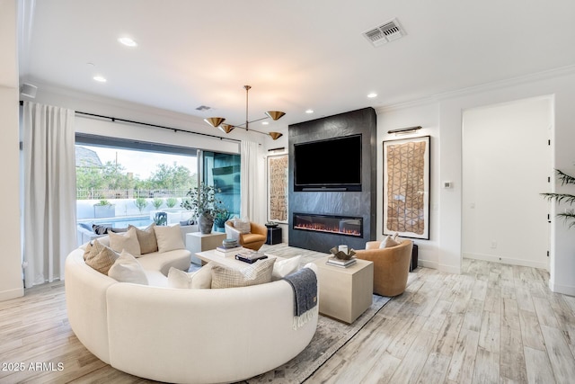 5901 E Sierra Morena St, Mesa, AZ 85215 - living area featuring baseboards, a fireplace, light wood-style flooring, and visible vents