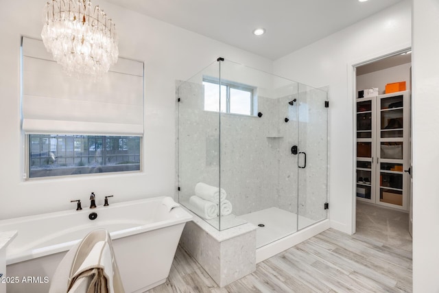 5901 E Sierra Morena St, Mesa, AZ 85215 - full bath featuring a freestanding bath, an inviting chandelier, a stall shower, and a spacious closet