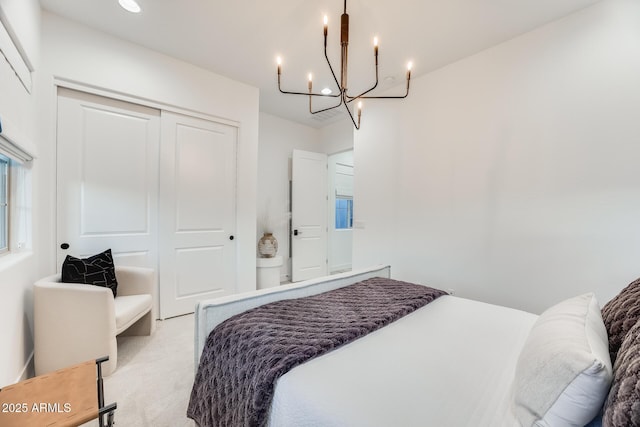 5901 E Sierra Morena St, Mesa, AZ 85215 - bedroom with light carpet, a closet, and a chandelier