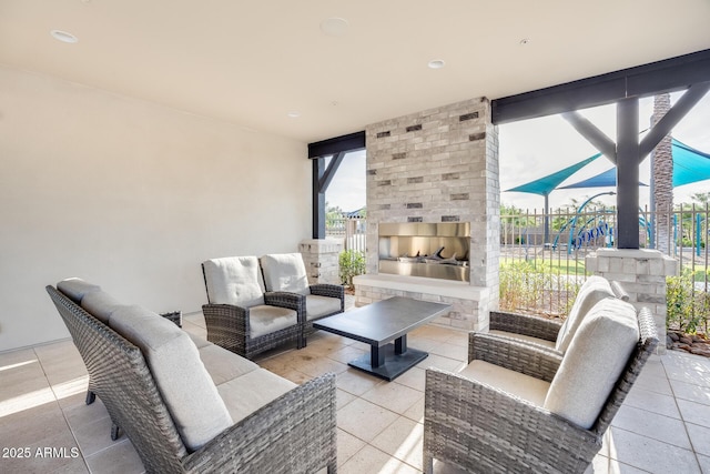 5901 E Sierra Morena St, Mesa, AZ 85215 - view of patio / terrace with fence and an outdoor living space with a fireplace