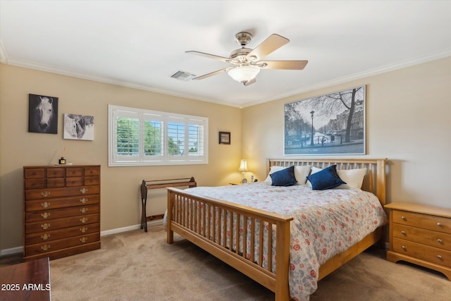 bedroom with visible vents, baseboards, a ceiling fan, crown molding, and carpet floors