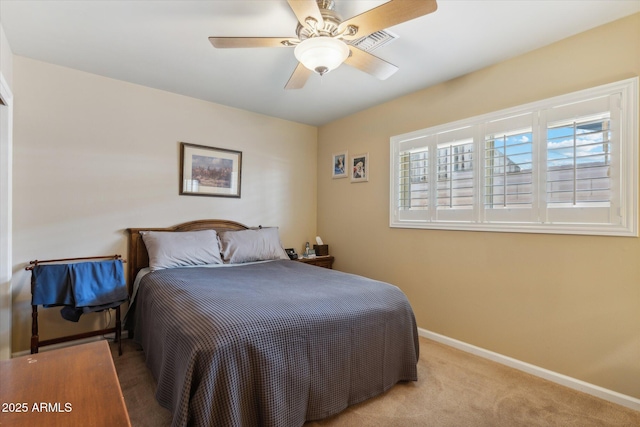 carpeted bedroom featuring ceiling fan, baseboards, and visible vents