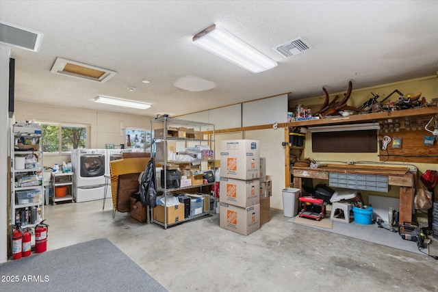 interior space featuring visible vents, independent washer and dryer, and a workshop area