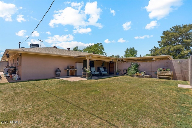 back of house featuring a patio, fence, and a lawn