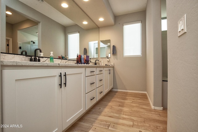 bathroom featuring vanity and wood-type flooring