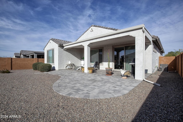 back of house with a patio area