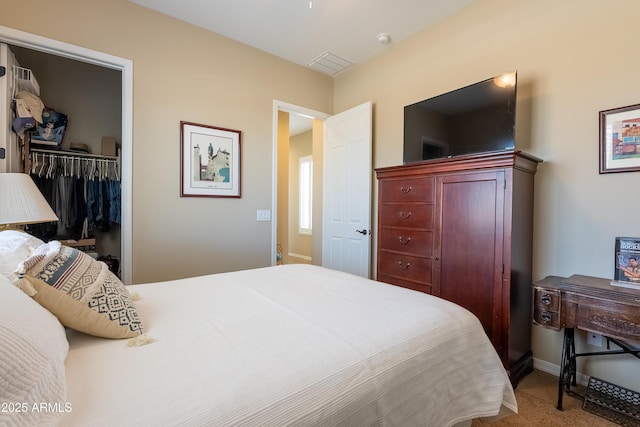 bedroom featuring baseboards, a closet, visible vents, and carpet flooring